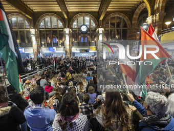 Hundreds of protesters flocked Amsterdam Centraal, the main central railway station and held a sit-in Pro-Palestine protest. A rally to mark...