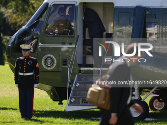 U.S. President Joe Biden salutes a U.S. Marine as he boards Marine One on the South Lawn of the White House, en route to Milwaukee, Wisconsi...