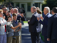 U.S. President Joe Biden speaks with guests at the White House before boarding Marine One en route to Milwaukee, Wisconsin and Philadelphia,...