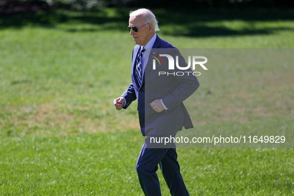 U.S. President Joe Biden jogs to speak with guests before boarding Marine One en route to Milwaukee, Wisconsin and Philadelphia, Pennsylvani...