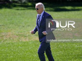 U.S. President Joe Biden jogs to speak with guests before boarding Marine One en route to Milwaukee, Wisconsin and Philadelphia, Pennsylvani...