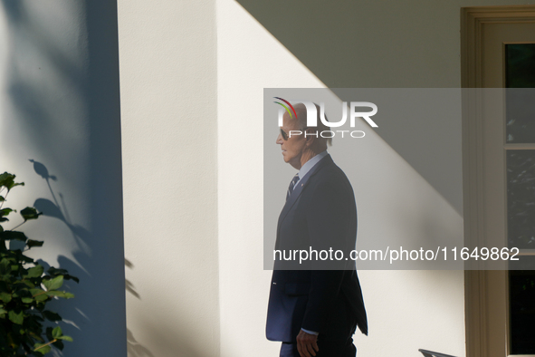 US President Joe Biden walks on the South Lawn of the White House before boarding Marine One in Washington, DC, US, on Tuesday, Oct. 8, 2024...