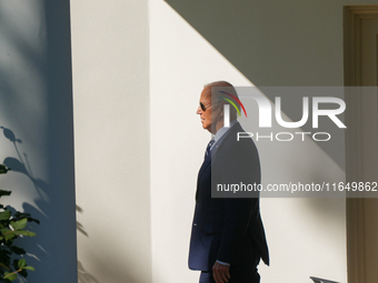 US President Joe Biden walks on the South Lawn of the White House before boarding Marine One in Washington, DC, US, on Tuesday, Oct. 8, 2024...