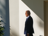 US President Joe Biden walks on the South Lawn of the White House before boarding Marine One in Washington, DC, US, on Tuesday, Oct. 8, 2024...