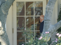 US President Joe Biden walks on the South Lawn of the White House before boarding Marine One in Washington, DC, US, on Tuesday, Oct. 8, 2024...