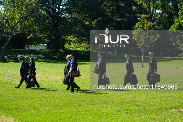 US President Joe Biden walks on the South Lawn of the White House before boarding Marine One in Washington, DC, US, on Tuesday, Oct. 8, 2024...