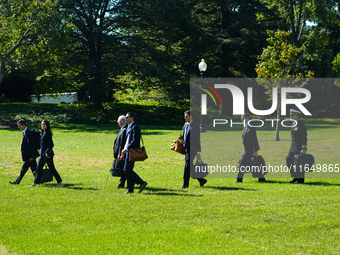 US President Joe Biden walks on the South Lawn of the White House before boarding Marine One in Washington, DC, US, on Tuesday, Oct. 8, 2024...