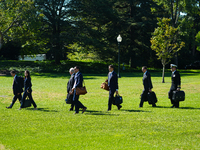 US President Joe Biden walks on the South Lawn of the White House before boarding Marine One in Washington, DC, US, on Tuesday, Oct. 8, 2024...