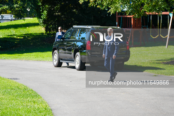 US President Joe Biden walks on the South Lawn of the White House before boarding Marine One in Washington, DC, US, on Tuesday, Oct. 8, 2024...