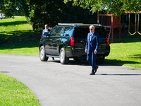 US President Joe Biden walks on the South Lawn of the White House before boarding Marine One in Washington, DC, US, on Tuesday, Oct. 8, 2024...