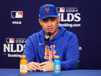 New York Mets manager Carlos Mendoza #64 speaks to the media during a press conference before the baseball game against the Philadelphia Phi...