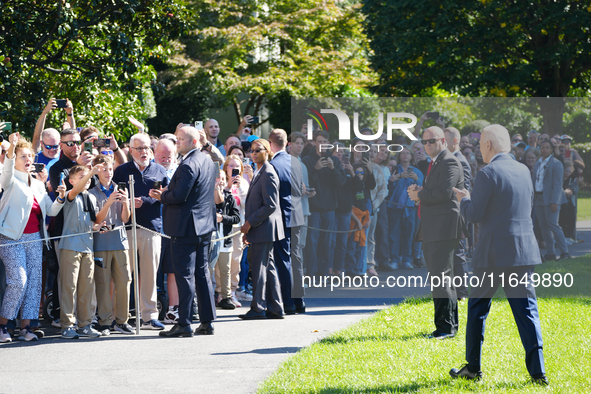 US President Joe Biden walks on the South Lawn of the White House before boarding Marine One in Washington, DC, US, on Tuesday, Oct. 8, 2024...