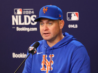 New York Mets manager Carlos Mendoza #64 speaks to the media during a press conference before the baseball game against the Philadelphia Phi...