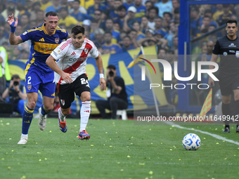 Marcos Acuna of River Plate and Cristian Lema of Boca Juniors participate in a Liga Profesional match between Boca Juniors and River Plate a...