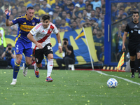 Marcos Acuna of River Plate and Cristian Lema of Boca Juniors participate in a Liga Profesional match between Boca Juniors and River Plate a...