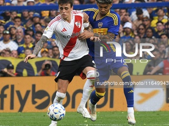 Nicolas Fonseca of River Plate and Cristian Medina of Boca Juniors participate in a Liga Profesional match between Boca Juniors and River Pl...