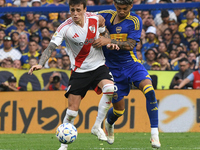 Nicolas Fonseca of River Plate and Cristian Medina of Boca Juniors participate in a Liga Profesional match between Boca Juniors and River Pl...