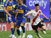 Franco Mastantuono of River Plate and Cristian Medina of Boca Juniors participate in a Liga Profesional match between Boca Juniors and River...