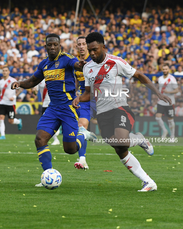 Luis Advincula of Boca Juniors and Miguel Borja of River Plate participate in a Liga Profesional match between Boca Juniors and River Plate...