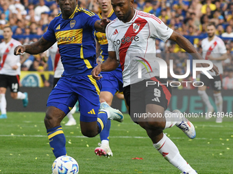 Luis Advincula of Boca Juniors and Miguel Borja of River Plate participate in a Liga Profesional match between Boca Juniors and River Plate...