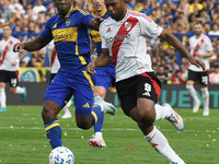 Luis Advincula of Boca Juniors and Miguel Borja of River Plate participate in a Liga Profesional match between Boca Juniors and River Plate...