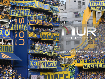 Fans of Boca Juniors cheer for their team before a Liga Profesional match between Boca Juniors and River Plate at Alberto J. Armando Stadium...