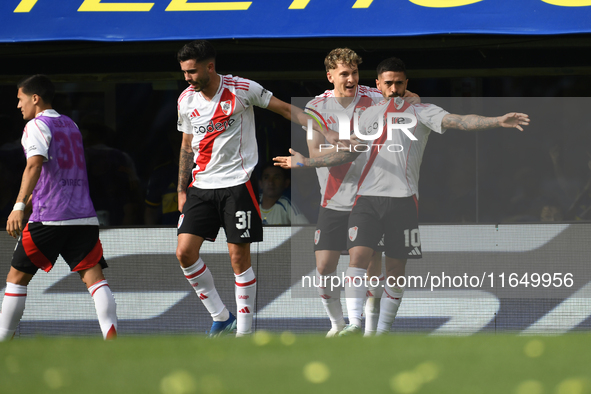 Manuel Lanzini, Facundo Colidio, and Santiago Simon of River Plate celebrate their team's goal during a Liga Profesional match between Boca...