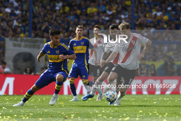 Facundo Colidio of River Plate and Paul Fernandez of Boca Juniors participate in a Liga Profesional match between Boca Juniors and River Pla...