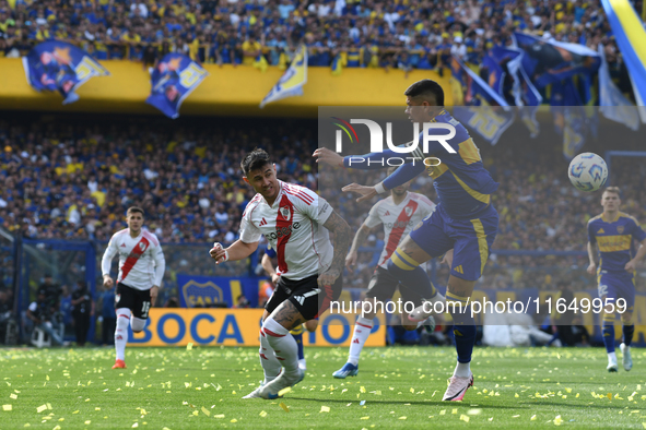 Adam Barreiro of River Plate and Marcos Rojo of Boca Juniors participate in a Liga Profesional match between Boca Juniors and River Plate at...