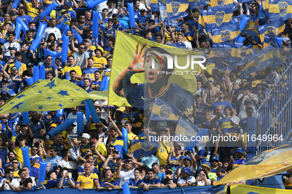 Fans of Boca Juniors cheer for their team before a Liga Profesional match between Boca Juniors and River Plate at Alberto J. Armando Stadium...