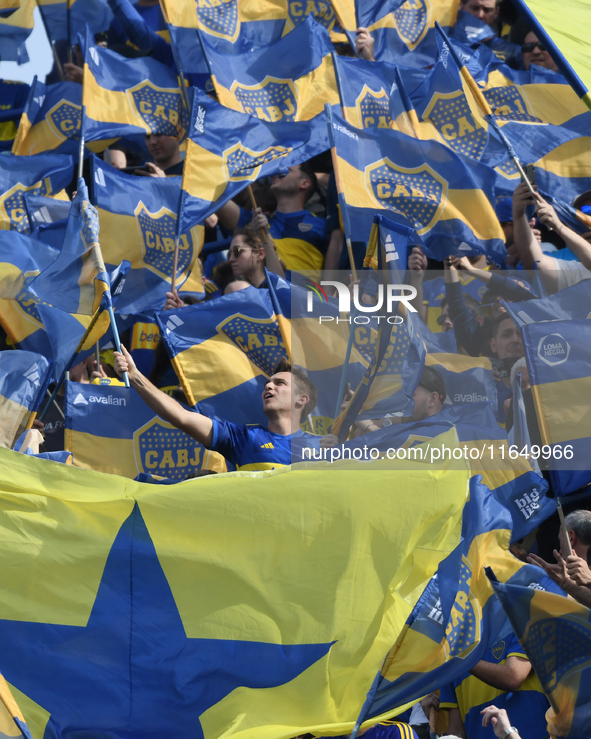 Fans of Boca Juniors cheer for their team before a Liga Profesional match between Boca Juniors and River Plate at Alberto J. Armando Stadium...