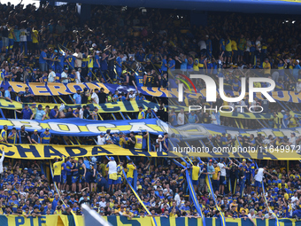 Fans of Boca Juniors cheer for their team before a Liga Profesional match between Boca Juniors and River Plate at Alberto J. Armando Stadium...