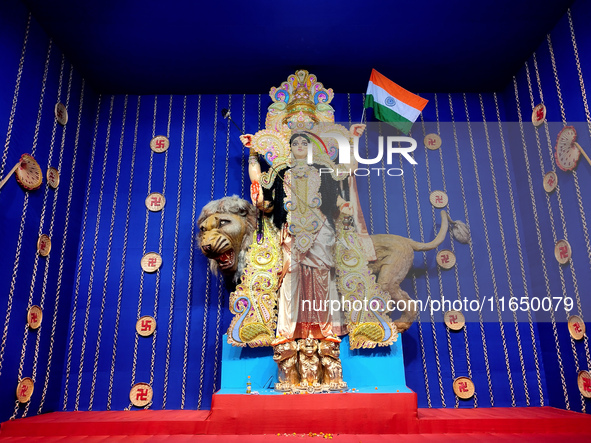 Devotees worship a Durga idol as a form of ''Bharat Mata'' inside a pandal or a temporary platform in Kolkata, India, on October 8, 2024, du...