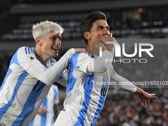 Paulo Dybala and Alejandro Garnacho of Argentina celebrate their team's goal during a match between Argentina and Chile at Estadio Mas Monum...