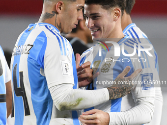 Julian Alvarez and Enzo Fernandez of Argentina celebrate their team's goal during a match between Argentina and Chile at Estadio Mas Monumen...