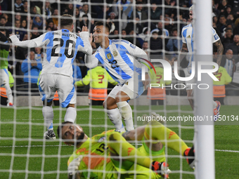 In Buenos Aires, Argentina, on September 5, Alexis Mac Allister and Lautaro Martinez of Argentina celebrate their team's goal during a match...