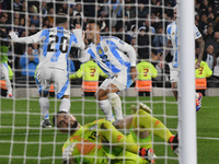 In Buenos Aires, Argentina, on September 5, Alexis Mac Allister and Lautaro Martinez of Argentina celebrate their team's goal during a match...