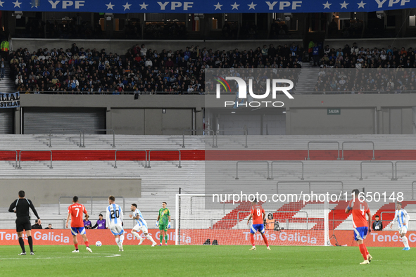 An empty stand is present due to a Conmebol ban during a match between Argentina and Chile at Estadio Mas Monumental Antonio Vespucio Libert...