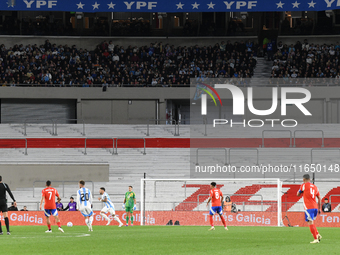 An empty stand is present due to a Conmebol ban during a match between Argentina and Chile at Estadio Mas Monumental Antonio Vespucio Libert...