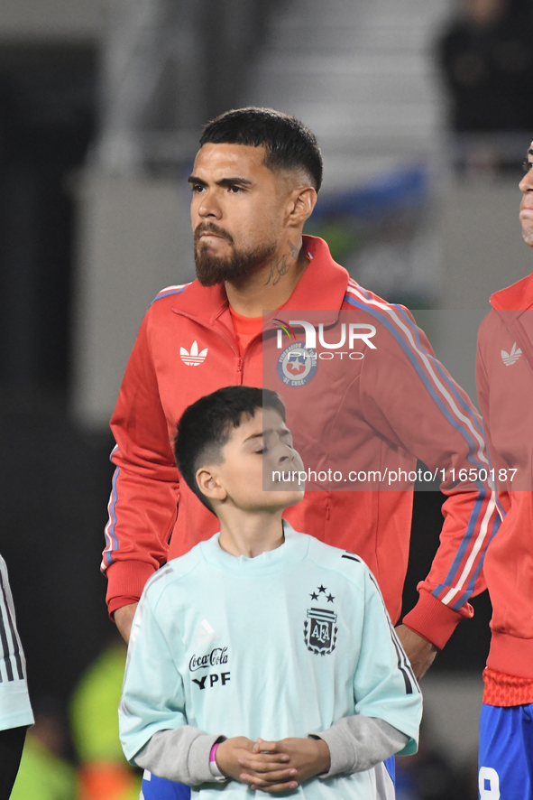 Paulo Diaz of Chile stands during the national anthems ceremony before a match between Argentina and Chile at Estadio Mas Monumental Antonio...