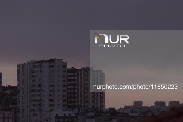 Cloudy skies are seen over buildings in Lisbon, Portugal, on October 8, 2024. Lisbon experiences mostly cloudy skies with temperatures rangi...