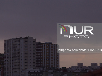 Cloudy skies are seen over buildings in Lisbon, Portugal, on October 8, 2024. Lisbon experiences mostly cloudy skies with temperatures rangi...