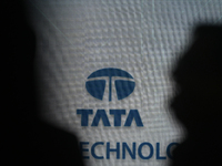 A Tata logo is seen during a press conference of a joint venture between Tata Technologies and BMW Group in Mumbai, India, on October 8, 202...