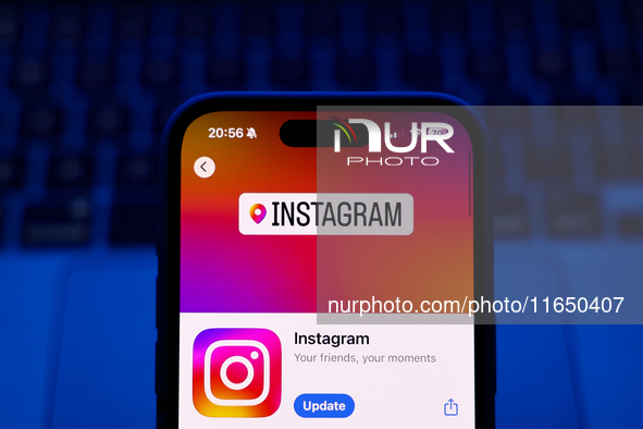 A laptop keyboard and Instagram on App Store displayed on a phone screen are seen in this illustration photo taken in Poland on October 8, 2...