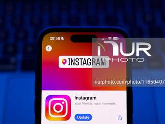 A laptop keyboard and Instagram on App Store displayed on a phone screen are seen in this illustration photo taken in Poland on October 8, 2...