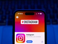 A laptop keyboard and Instagram on App Store displayed on a phone screen are seen in this illustration photo taken in Poland on October 8, 2...