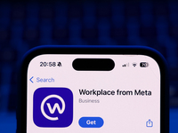 A laptop keyboard and Workplace on App Store displayed on a phone screen are seen in this illustration photo taken in Poland on October 8, 2...