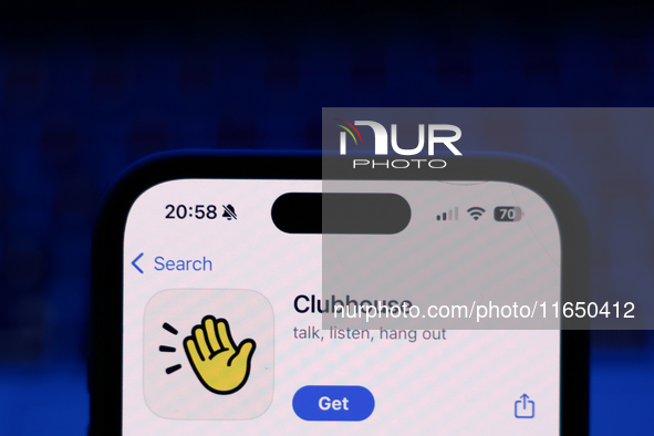A laptop keyboard and Clubhouse on App Store displayed on a phone screen are seen in this illustration photo taken in Poland on October 8, 2...