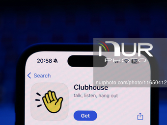 A laptop keyboard and Clubhouse on App Store displayed on a phone screen are seen in this illustration photo taken in Poland on October 8, 2...