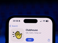 A laptop keyboard and Clubhouse on App Store displayed on a phone screen are seen in this illustration photo taken in Poland on October 8, 2...